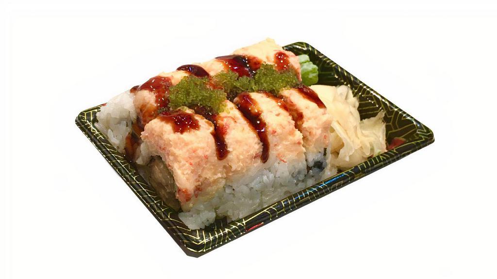 Ocean Roll · Shrimp tempura topped with lobster salad, wasabi tobiko and eel sauce.