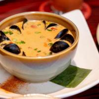 Levanta Muerto Seafood Soup · “Raise the Dead” soup with a rich Chino Cubano broth. Shrimp, Baja bay scallops, crabmeat, m...