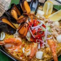 Paella Marinera · Jumbo shrimp, Maine lobster tail, mussels, squid, Baja Bay scallops, claw crabmeat, saffron ...