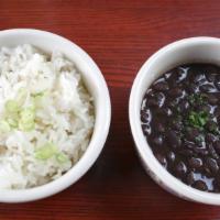 Arroz Con Frijoles · Steamed white rice and black beans.