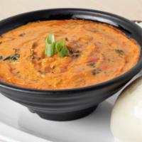 Taushe Stew (Contains Nuts) · A northern creamy peanut stew simmered with vegetables and a blend of herbs and traditional ...