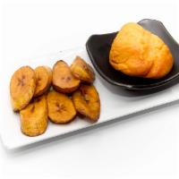 Moi Moi And Plantains · Bean cake made from black-eyed peas blended with peppers and onions served with plantains & ...