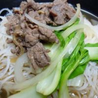 Rice Noodle Soup · Hot rice noodles cooked in house broth with beef and vegetables.