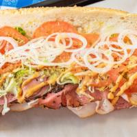 The Cozy Hoagie · Seeded Italian roll stuffed with layers of sliced-to-order Pastrami, Turkey, Salami, Corned ...