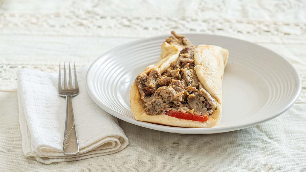 Pork, Chicken Or Lamb & Beef Gyro · Your choice of gyro meat wrapped in a pita sandwich with tomatoes, onions & your choice of condiment. *Chicken gyro includes lettuce in sandwich