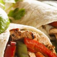 Fajita Burrito · Stuffed with your choice of steak, chicken, mixed or vegetarian style, grilled peppers and o...