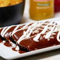 Mexi Enchiladas Plate · Three corn tortillas stuffed with cheese, your choice of meat or veggies topped with red, gr...