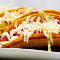 Crispy Taco · 1 piece. Crispy corn tortilla filled with lettuce, tomatoes, sour cream, cheese, and your ch...