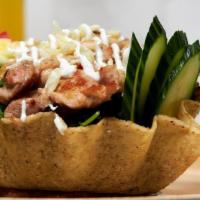 Taco Salad · Fried flour tortilla bowl filled with mixed greens, tomatoes, beans cheese, sour cream, and ...