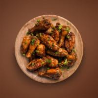 Traditional Bone-In Wings 12 Pcs · (12 Pcs) Traditional bone-in wings in your choice of sauce.