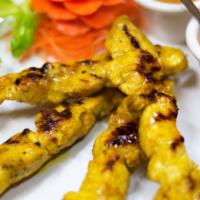 Satay · Curry marinated chicken or beef skewered and grilled to perfection. Served with traditional ...