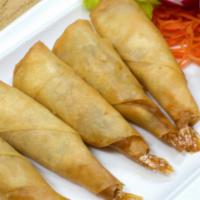 Shrimp Blanket · Marinated shrimp wrapped with egg roll skin served with sweet and sour sauce.