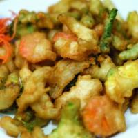 Vegetable Tempura · Assorted vegetables with light battered and deep-fried until golden brown. Served with Thai ...