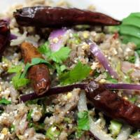 Larb Salad · Spicy. Minced ground chicken tossed with red onion, scallions, rice powder and seasoned with...
