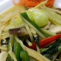Green Curry · Spicy. A blend of fresh green chili, sautéed in hot green curry sauce and coconut milk with ...