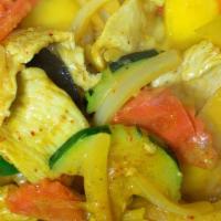 Mango Curry · Spicy. Fresh mango chunks in red curry sauce and coconut milk with zucchini, carrots, bell p...