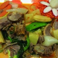 Duck Choo Chee · Boneless roasted duck in red curry paste with mixed vegetables.