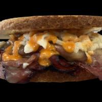 The Grandfather · Hot pastrami, corn beef, turkey or roast beef, Russian dressing, Cole slaw, and melted Swiss...