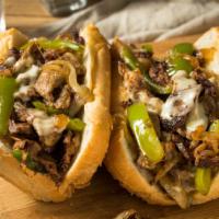 Philly Cheese Steak Sandwich · Grilled beef, steak, multicolored bell peppers, grilled onions, melted cheese, served on her...