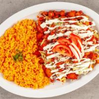 Enchiladas Rojas Estilo Michoacán / Red Michoacan Style Enchiladas · Con pollo, papas y zanahorias fritas, queso y crema agria con acompañante de arroz y ensalad...