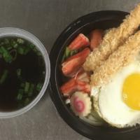 Nabeyaki Udon · 2 piece shrimp tempura, seafood, seasonal vegetable and poached egg on top of udon in mild c...