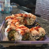 Scorpion Roll · Eel, cucumber, avocado and tobiko topped with layer of shrimp and eel sauce.