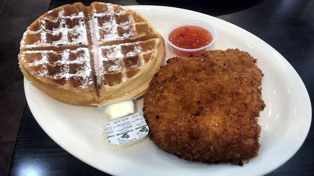 Chicken & Waffle · Two pieces of deep fried marinated panko breaded boneless chicken breast and waffle, powder sugar, butter and sweet chili sauce.