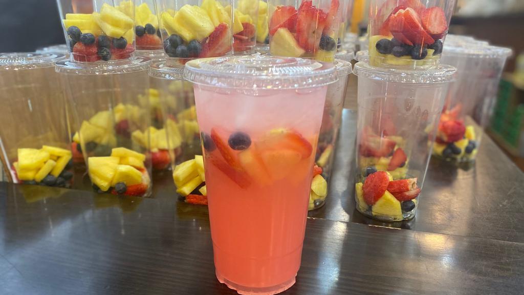 Fruit Juice · 32oz. Pink Lemonade with freshly cut pineapples, strawberries and blueberries.