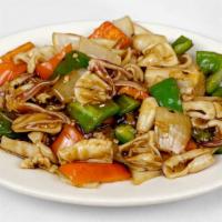 Calamari With Black Bean Sauce · 豆豉鮮魷 — Calamari sauteed with peppers and onions, in a rich black bean sauce.