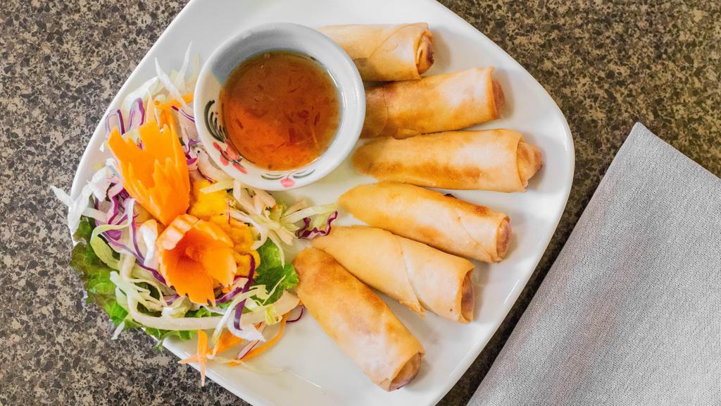 Thai Spring Rolls · Crispy spring rolls filled with chicken, vegetables, and scallions. Served with sweet and sour sauce. Available vegetarian.