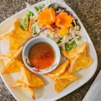 Crab Rangoon · Homemade fried wontons filled with cream cheese, crab meat, carrots, and onions. Serve with ...