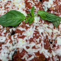 Eggplant Parmesan · Half tray serves 7-10 eggplant layered with sauce and cheeses.