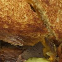 Classic Beef Brisket · Slow cooked, horseradish sauce, Cheddar cheese.