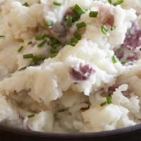 Creamy Garlic Mashed Potatoes · Enjoy our hand-peeled and spoon-mashed red bliss creamy mashed potatoes that have just the r...