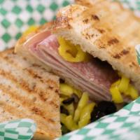 Italian Panini · Genoa salami, deluxe ham, pepperoni, provolone, olives, banana peppers and fiery chipotle go...