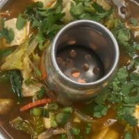Tom Yum · Choice of meat cooked in hot, sour broth with lemongrass, spiced paste with mushroom.