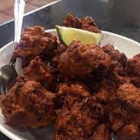 Chicken Pakora · Lightly fried chicken marinated in Indian spices and encrusted with chickpea flour.