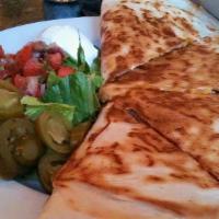 Quesadilla · A cheese quesadilla with grilled or shredded chicken, steak or spinach options served with s...