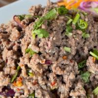 Beef Larb Salad · Spicy minced beef, with fresh mint, red onion, dried chili, in sweet chili lime dressing, ro...