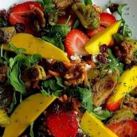 Full Mango & Strawberry Salad · Baby arugula, mango, Brussels sprouts, avocado, and sweet candied walnuts. Topped with goat ...