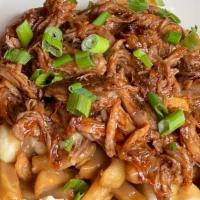 Pulled Pork Poutine · House Made Poutine Sauce, Crispy Fries, Cheddar Cheese Curds, and Scallions. Topped with Slo...