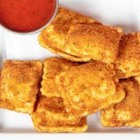 Toasted Ravioli · Lightly fried cheese ravioli served with marinara sauce for dipping.