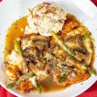 Chicken Madeira · Sautéed chicken cutlet, asparagus, melted mozzarella cheese prepared in a mushroom marsala w...