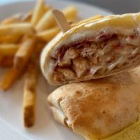 Chicken Bacon Ranch Wrap · Crispy fried chicken, bacon, ranch dressing, melted mozzarella and provolone cheese in a toa...
