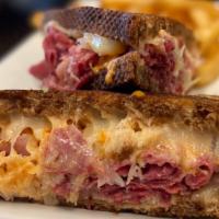 Grilled Reuben · Corned beef, sauerkraut, Swiss cheese and Russian dressing served on grilled marble rye.