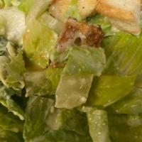 Caesar Salad · Fresh Crisp Romaine Tossed with Parmesan Cheese, Croutons & Homemade Caesar Dressing.