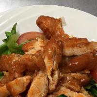 Buffalo Crispy Chicken Salad · Crispy Chicken Tenders Tossed with Hot Sauce, over Fresh Romaine Lettuce & Tomatoes with Ble...