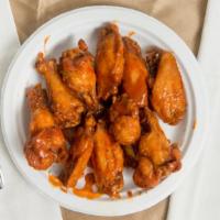 Signature Wings (20) · In your choice of two sauces or rubs.