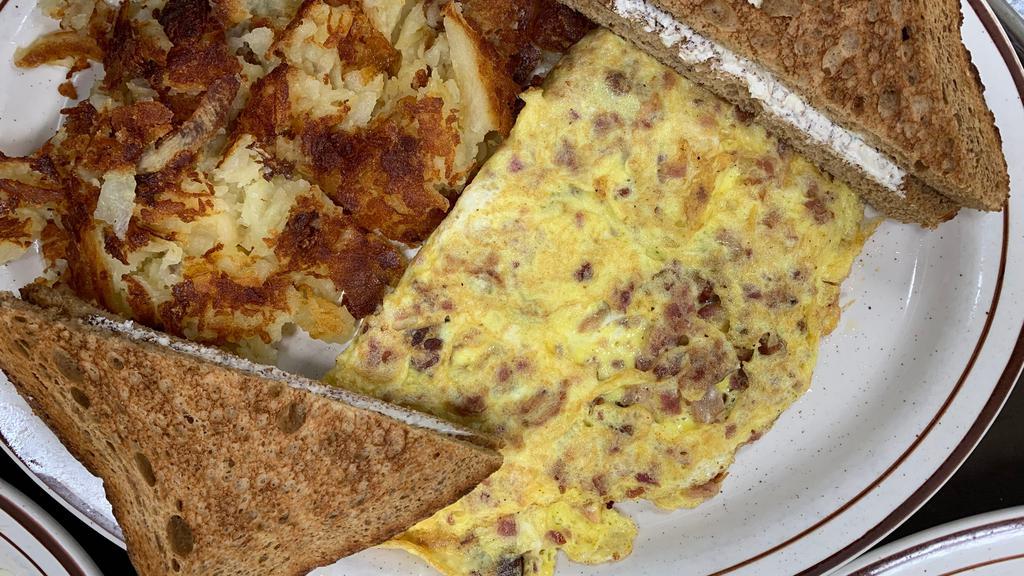 Bacon Omelette · Omelettes are made with three eggs.