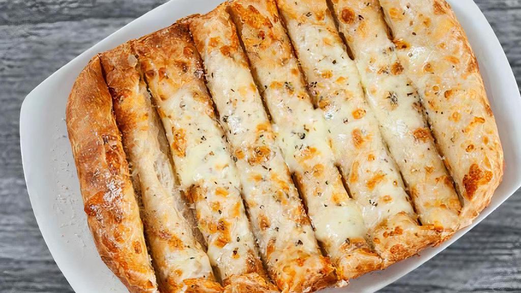 Cheezy Breadsticks · Our breadsticks topped with a blend of melted cheeses, oregano, garlic and butter, served with marinara.